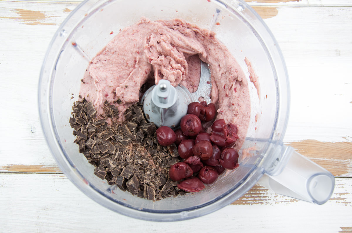 cherry nice cream, chocolate chunks, and sour cherries in food processor