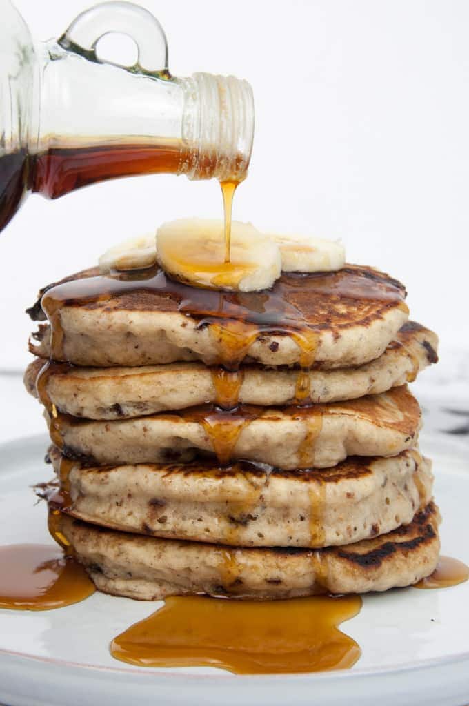 Vegan Banana Bread Pancakes with Chocolate Chunks drizzled with maple syrup