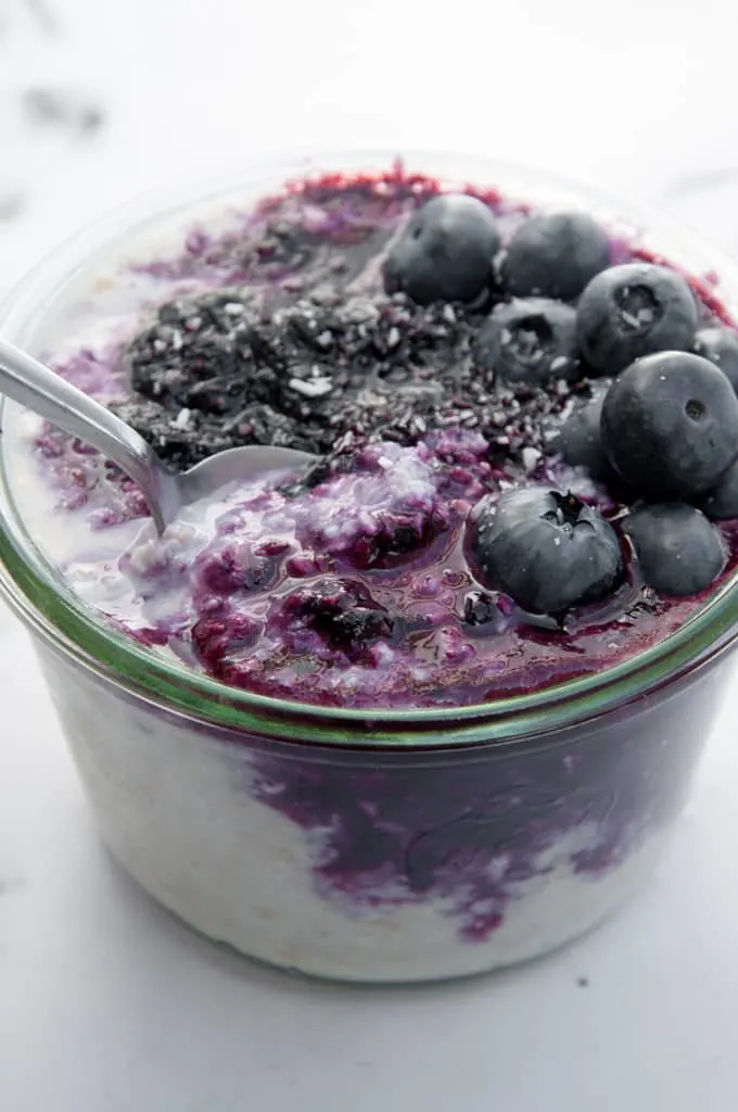 Dairy-Free Overnight Oats with warm blueberry sauce