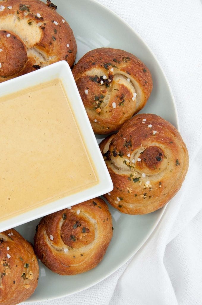 Vegan Pretzel Garlic Knots with a 'cheesy' dip