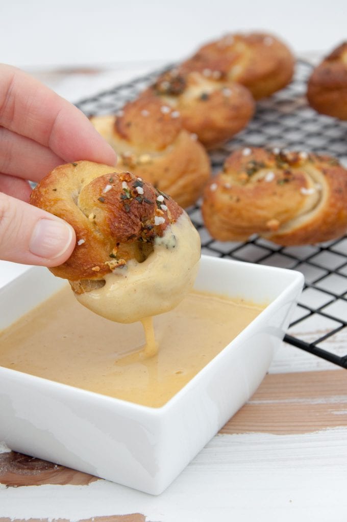 Pretzel Garlic Knot with cheese dripping off