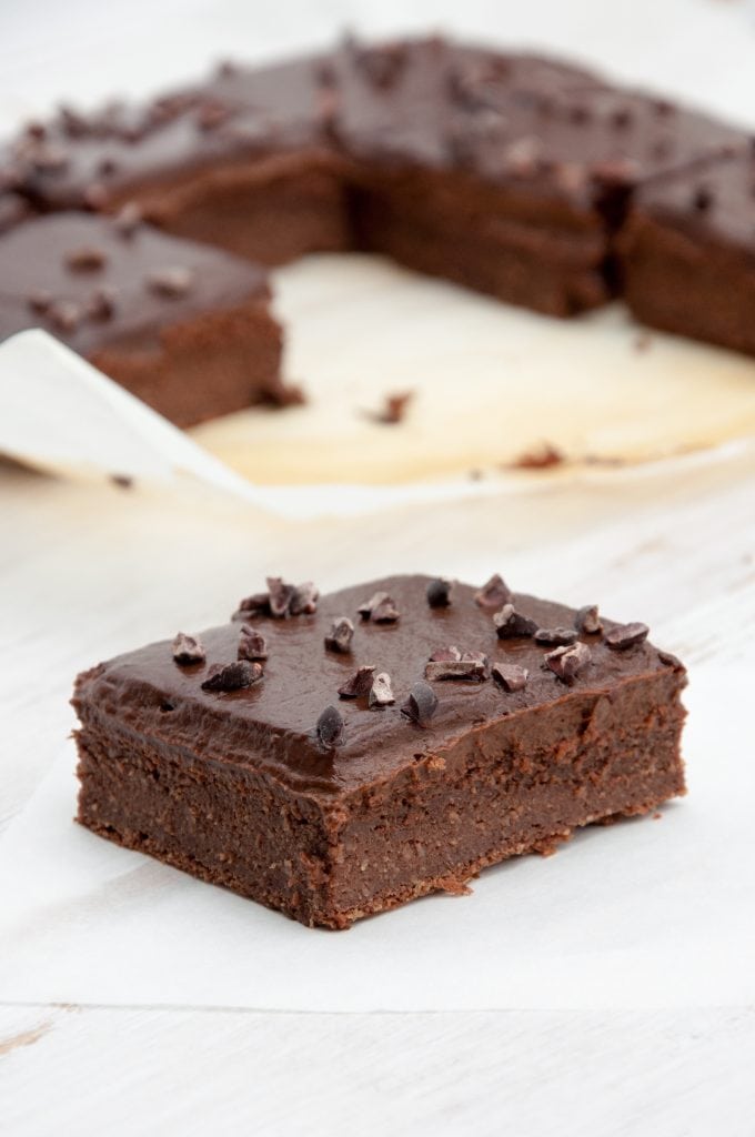 Blender Brownies with Avocado Frosting and cocoa nibs