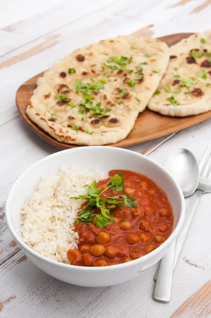 Tomato Coconut Chickpea Curry with white rice and cilantro naan