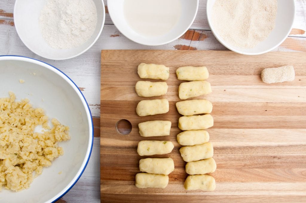 Making Potato Croquettes: potato dough, flour, plant-based milk and breadcrumbs