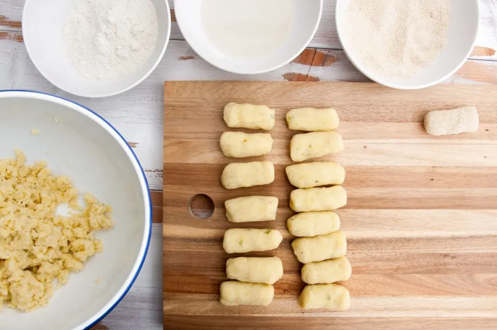 Making Potato Croquettes: potato dough, flour, plant-based milk and breadcrumbs