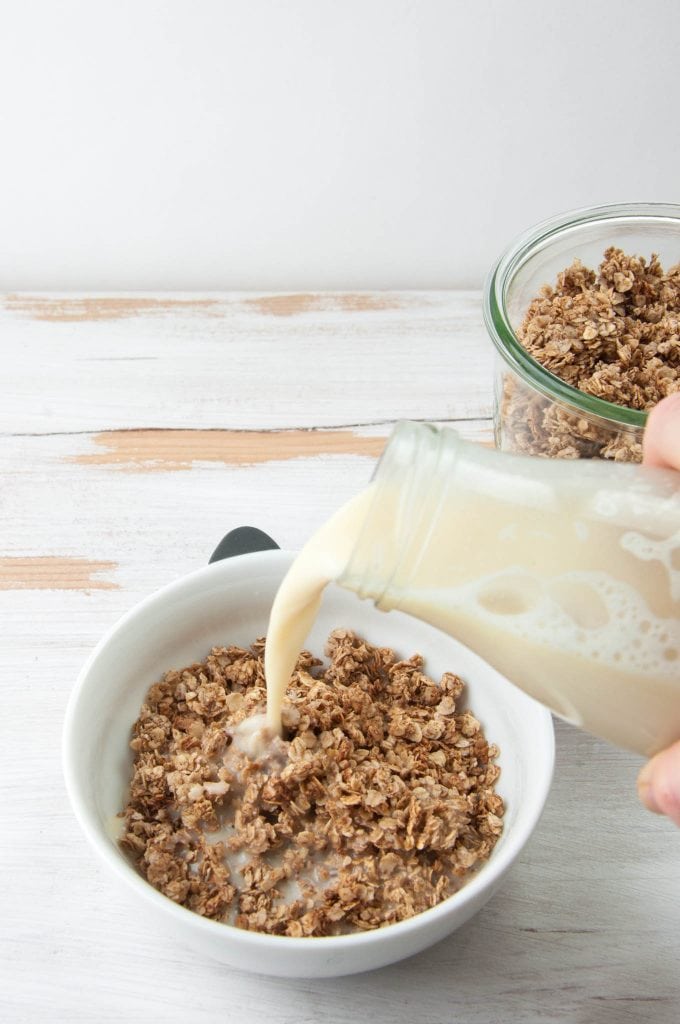 Almond Milk poured over vegan Gingerbread Granola