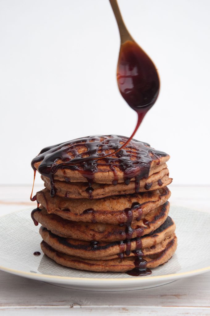 Vegan Gingerbread Pancakes drizzled with date syrup