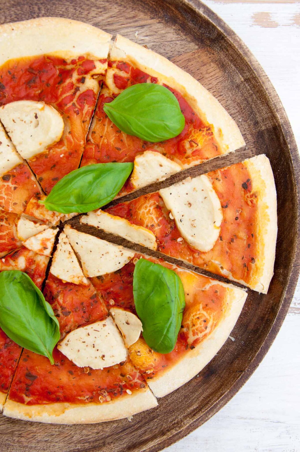 Cashew Mozzarella on pizza with basil