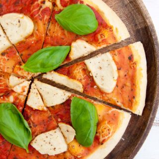 Cashew Mozzarella on pizza with basil