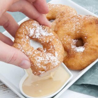 Vegan Apple Fritter Rings dipped in almond maple sauce