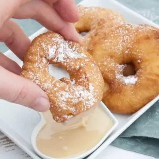 Vegan Apple Fritter Rings dipped in almond maple sauce