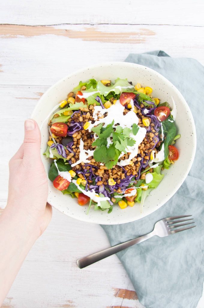 Vegan Taco Salad Bowl with Walnut Meat, corn, cabbage, tomatoes, vegan mayo and cilantro