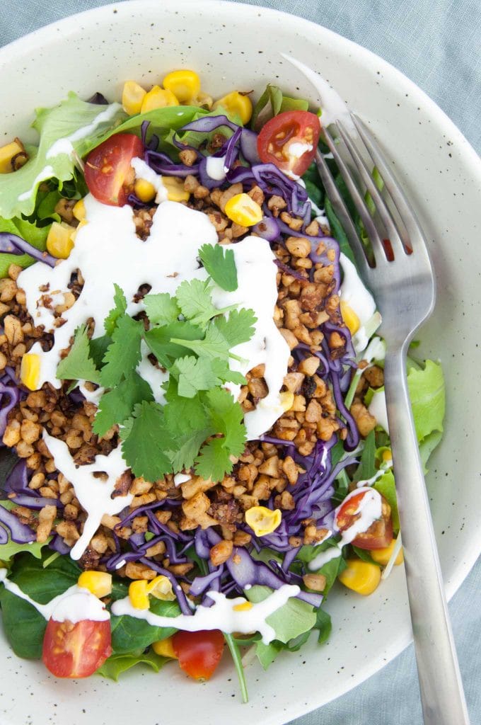 Vegan Taco Salad Bowl with Walnut Meat, corn, cabbage, tomatoes, vegan mayo and cilantro