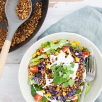 Vegan Taco Salad with Walnut Meat, corn, cabbage, tomatoes, vegan mayo and cilantro