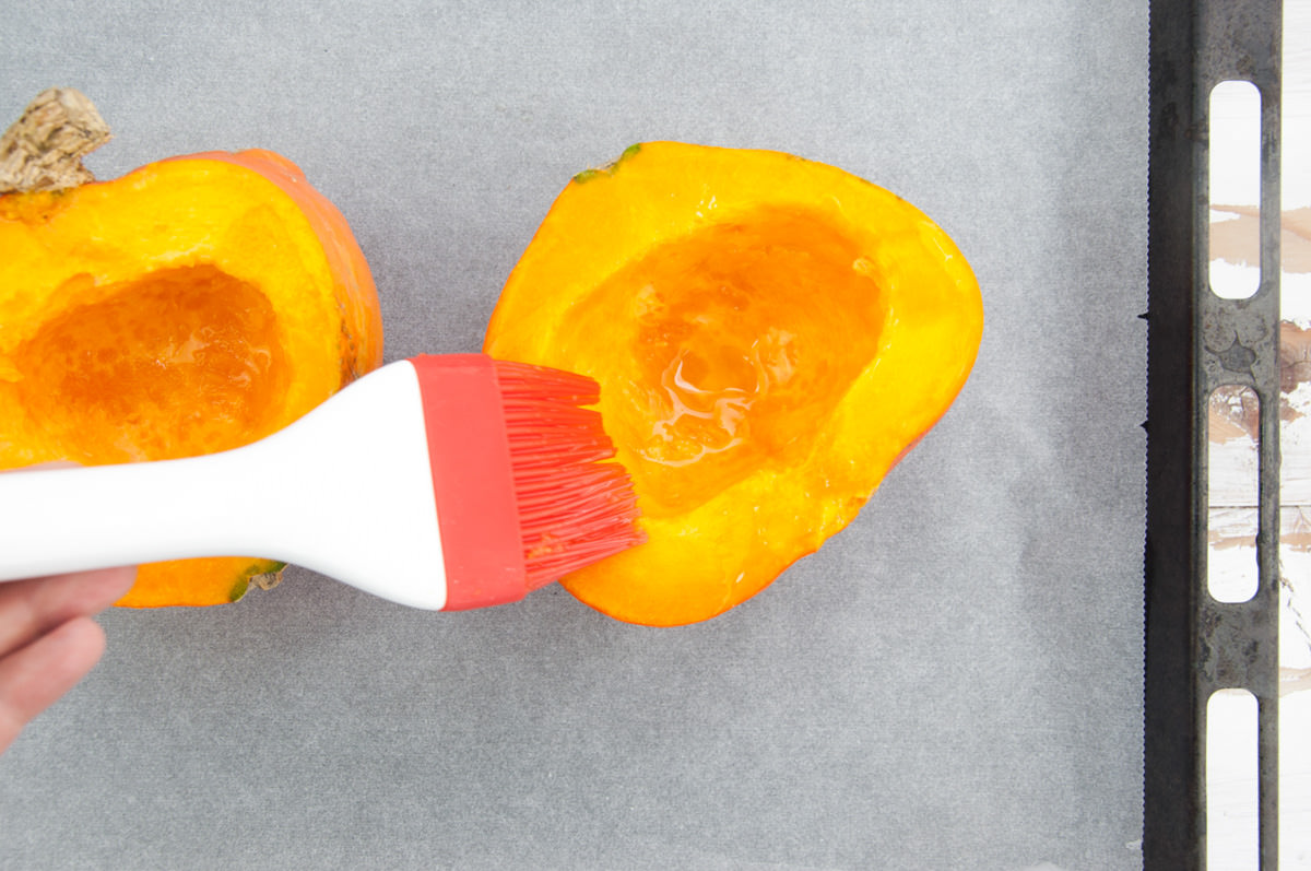 brushing pumpkin with oil