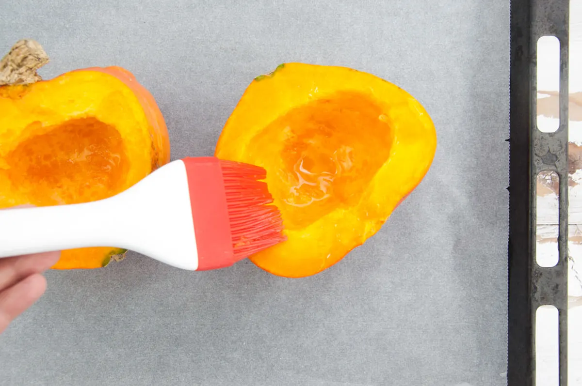 brushing pumpkin with oil