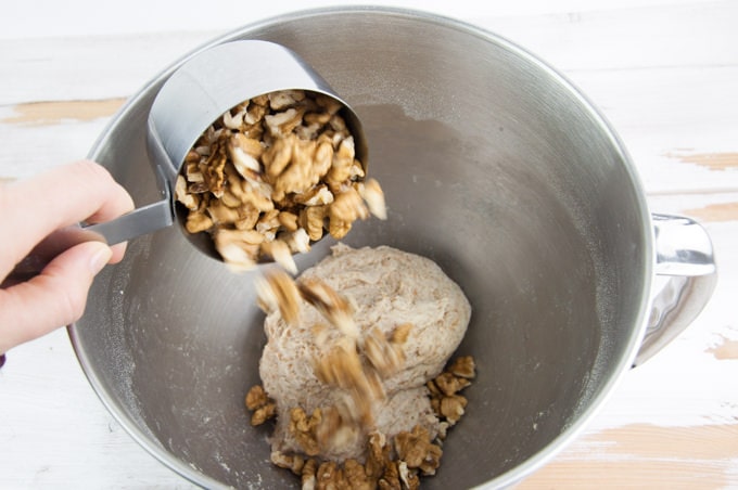 Making Walnut Bread: Adding walnuts to the bread dough