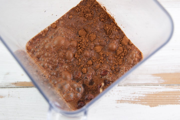 hazelnuts, cocoa powder, dates, and water in blender