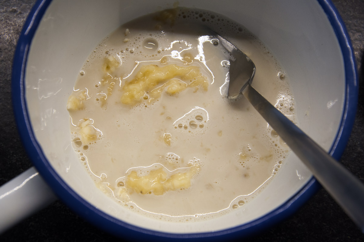 mashed bananas and plant-based milk in bowl