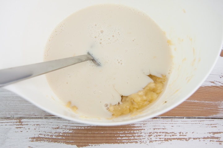 mashed banana, almond milk, and agave syrup in a bowl