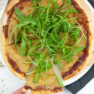 Vegan Cheese Pizza topped with arugula