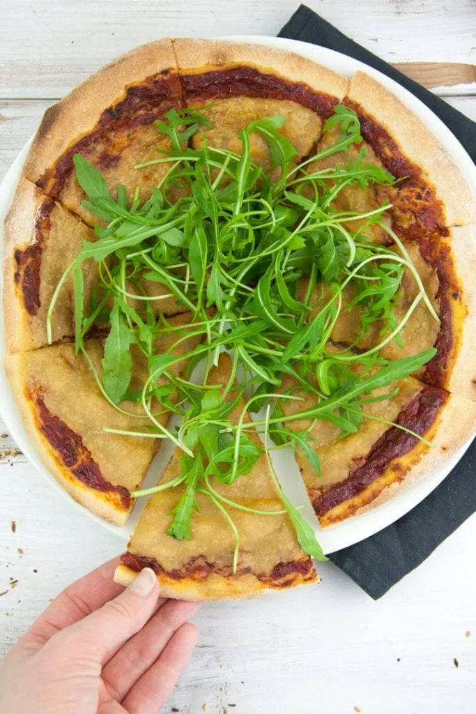 Vegan Cheese Pizza topped with arugula