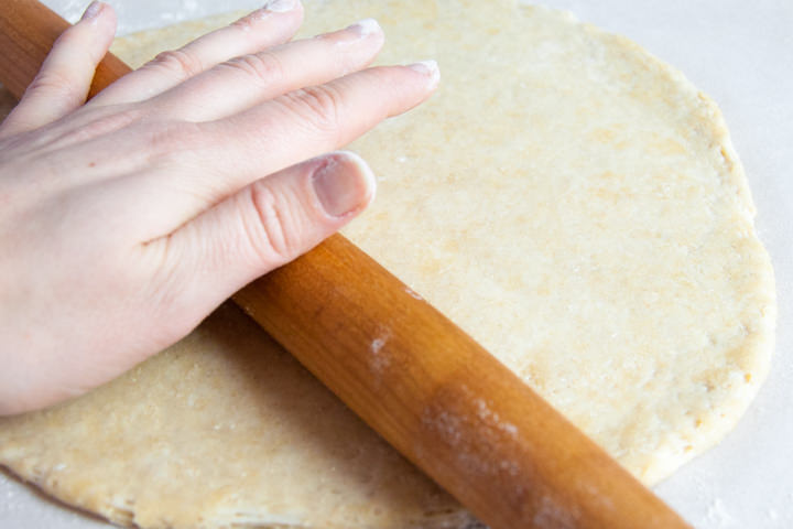 rolling out donut dough