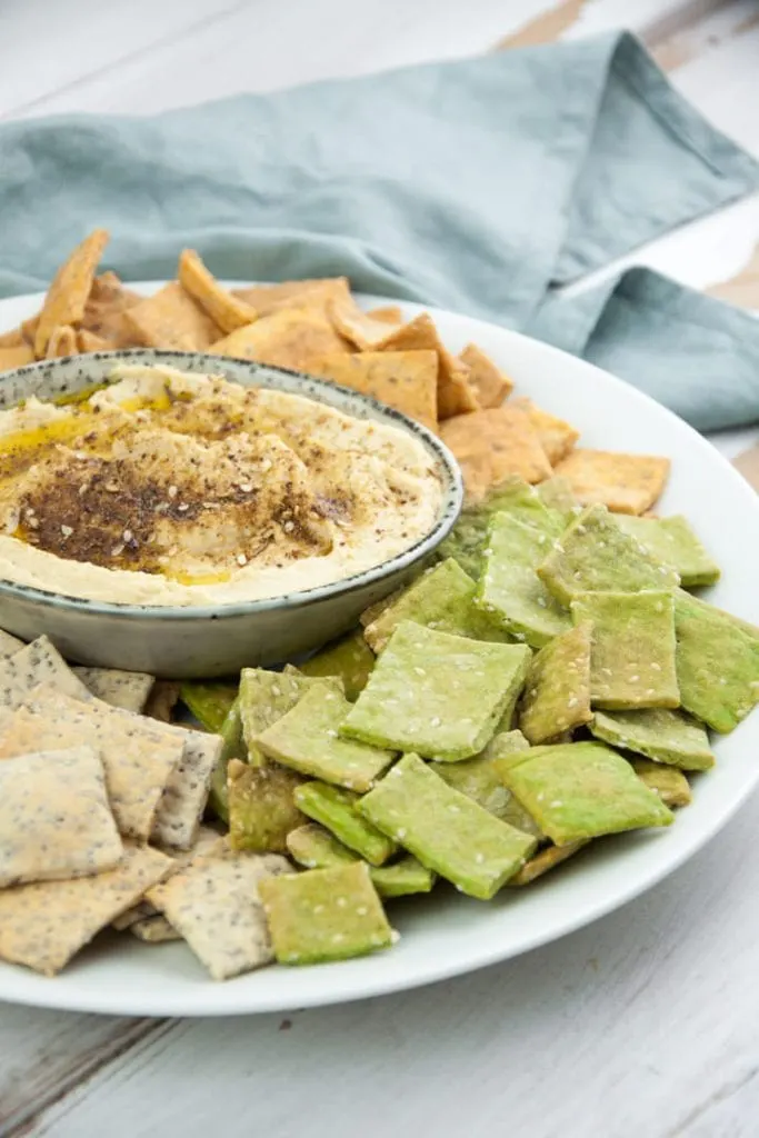 Za'atar Hummus served with colorful crackers