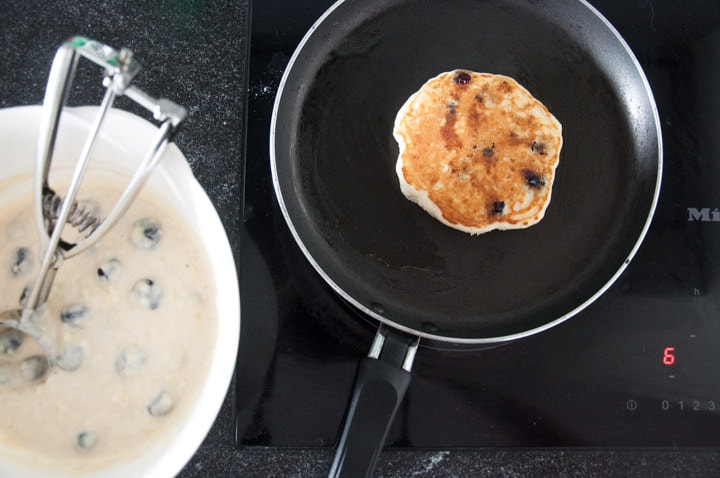 making blueberry pancakes