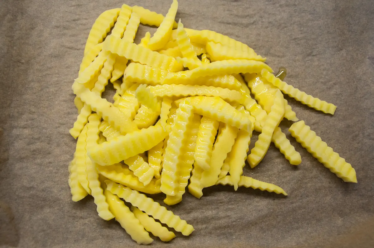 crinkle cut fries on parchment paper