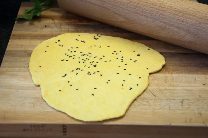 rolling out golden turmeric naan