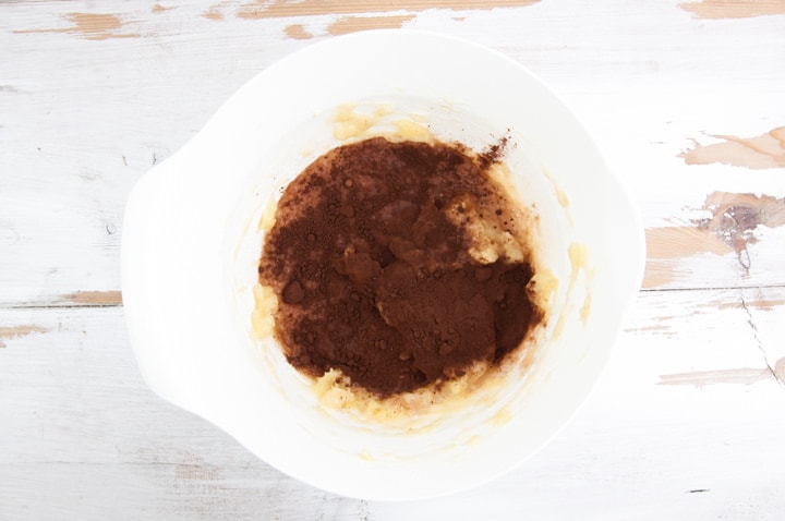 mashed bananas, cocoa powder and almond milk in a bowl