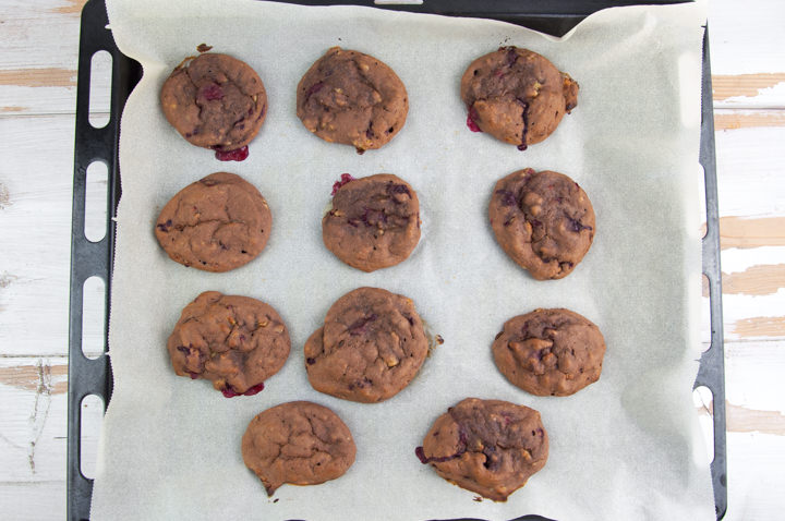 Sugar-Free Chocolate Cookies with Raspberries on a baking tray