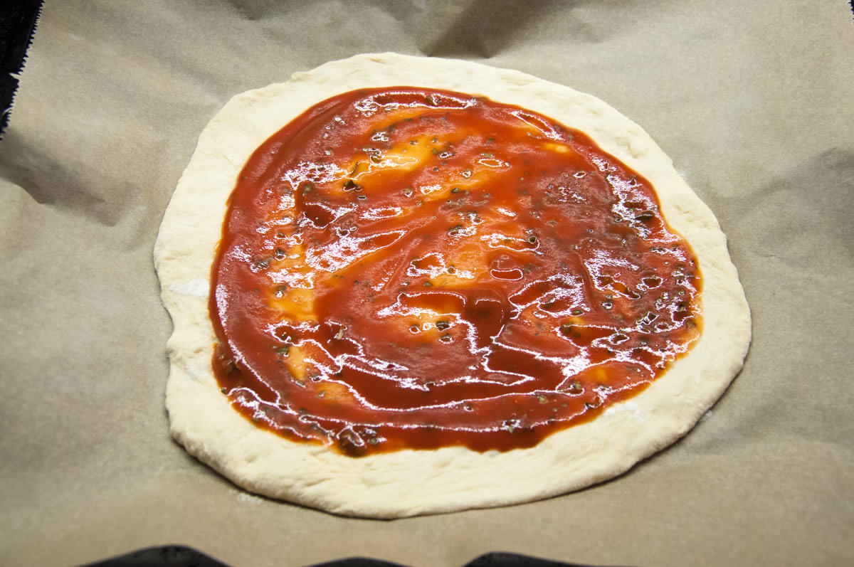 pizza base and tomato sauce