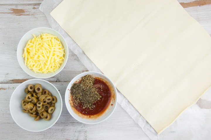 puff pastry dough, tomato sauce, vegan cheese and olives