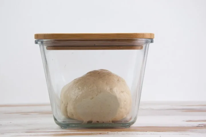 Yeast dough in glass container