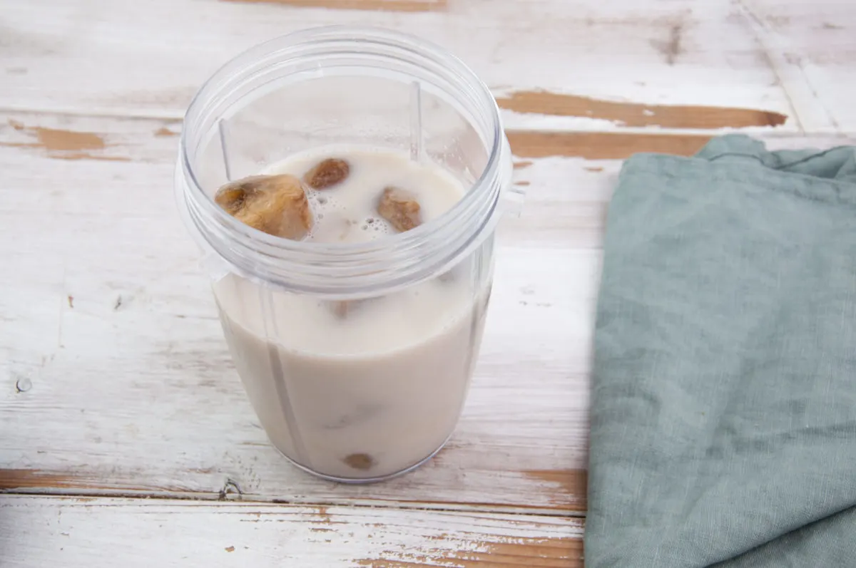 coffee, plant-based milk, frozen bananas in blender