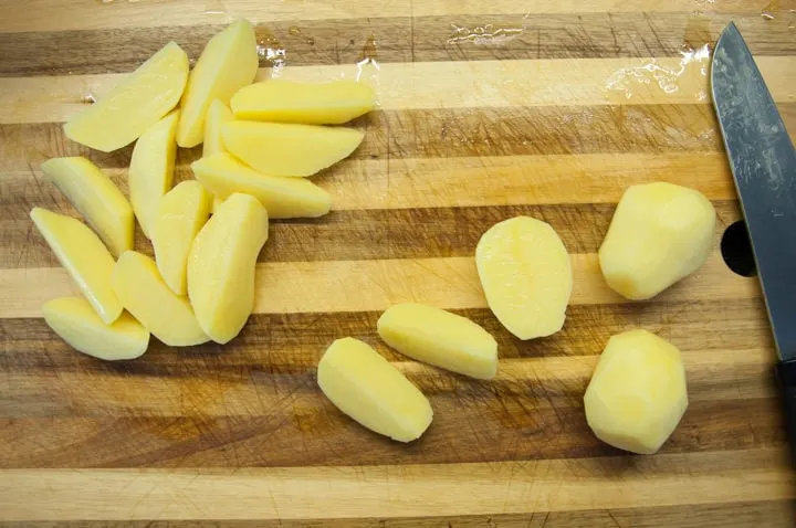 cutting potatoes in wedges