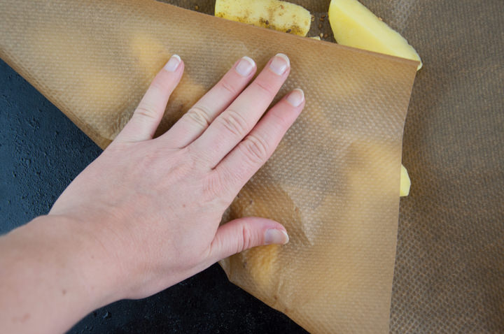 coating potato wedges in seasoning