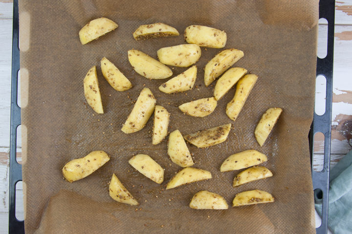 potato wedges on a baking tray