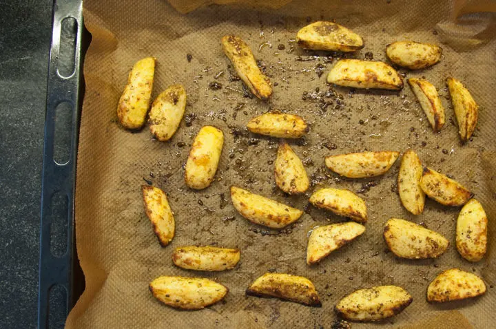 potato wedges on a baking tray
