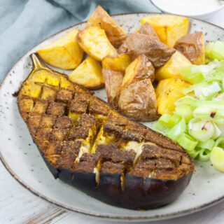 oven roasted eggplant with ras el hanout seasoning served with potato and leeks