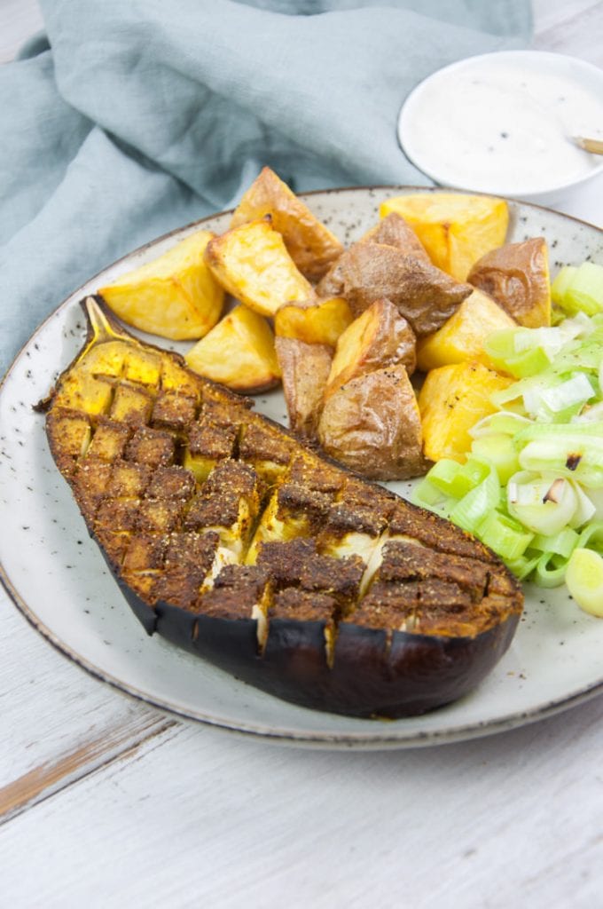 oven roasted eggplant with ras el hanout seasoning served with potato and leeks