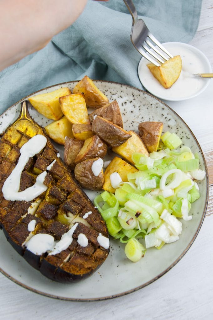 oven roasted eggplant with ras el hanout seasoning and yogurt sauce