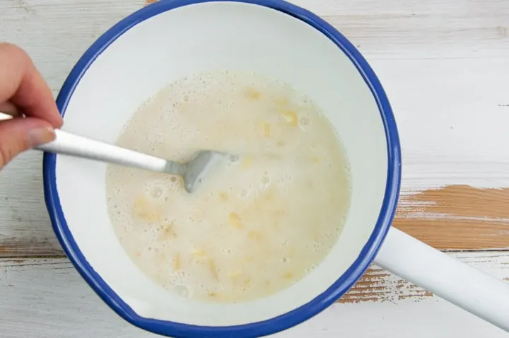 mashed banana, maple syrup and plant-based milk in a bowl