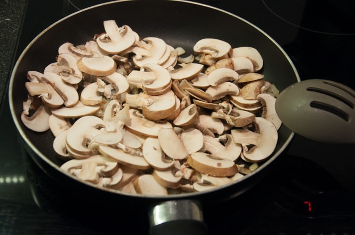 cooking mushrooms in pan