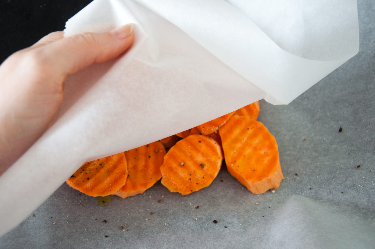 coating sweet potato slices in oil