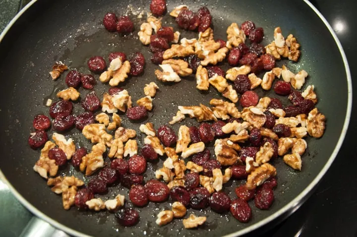 walnuts and cranberries in pan