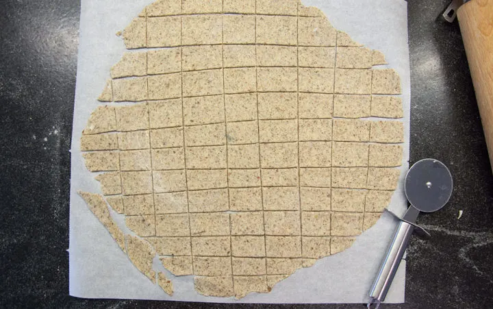 unbaked crackers on parchment paper