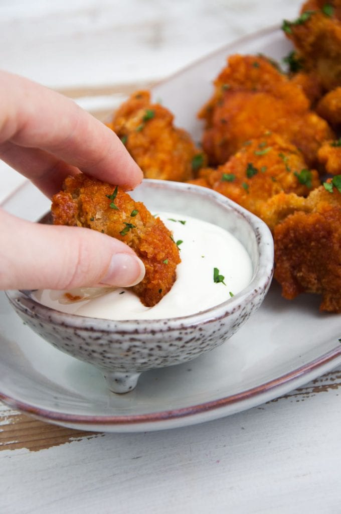 spicy cauliflower wings dipped in mayo